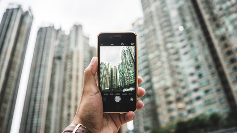 Smartphone taking a photo of a building