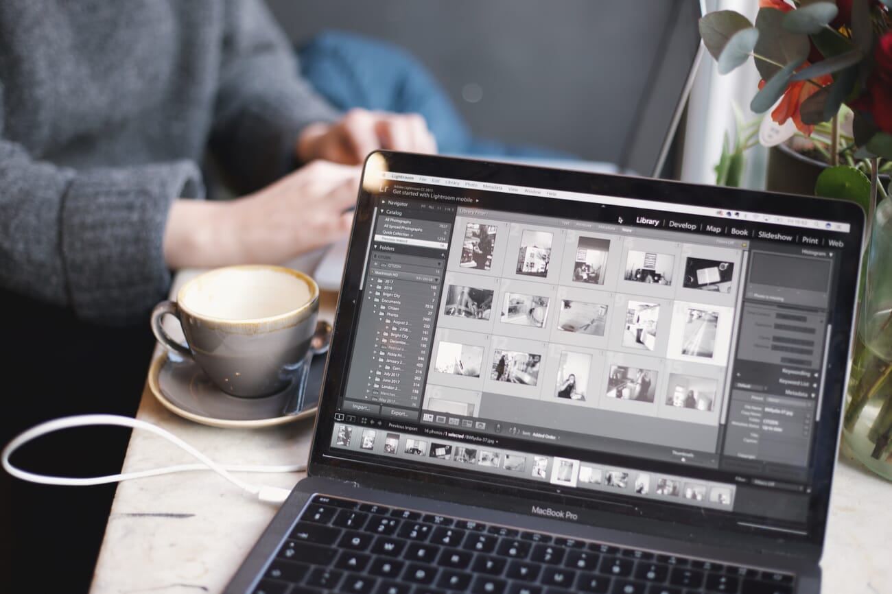 Computer with Lightroom open on a table