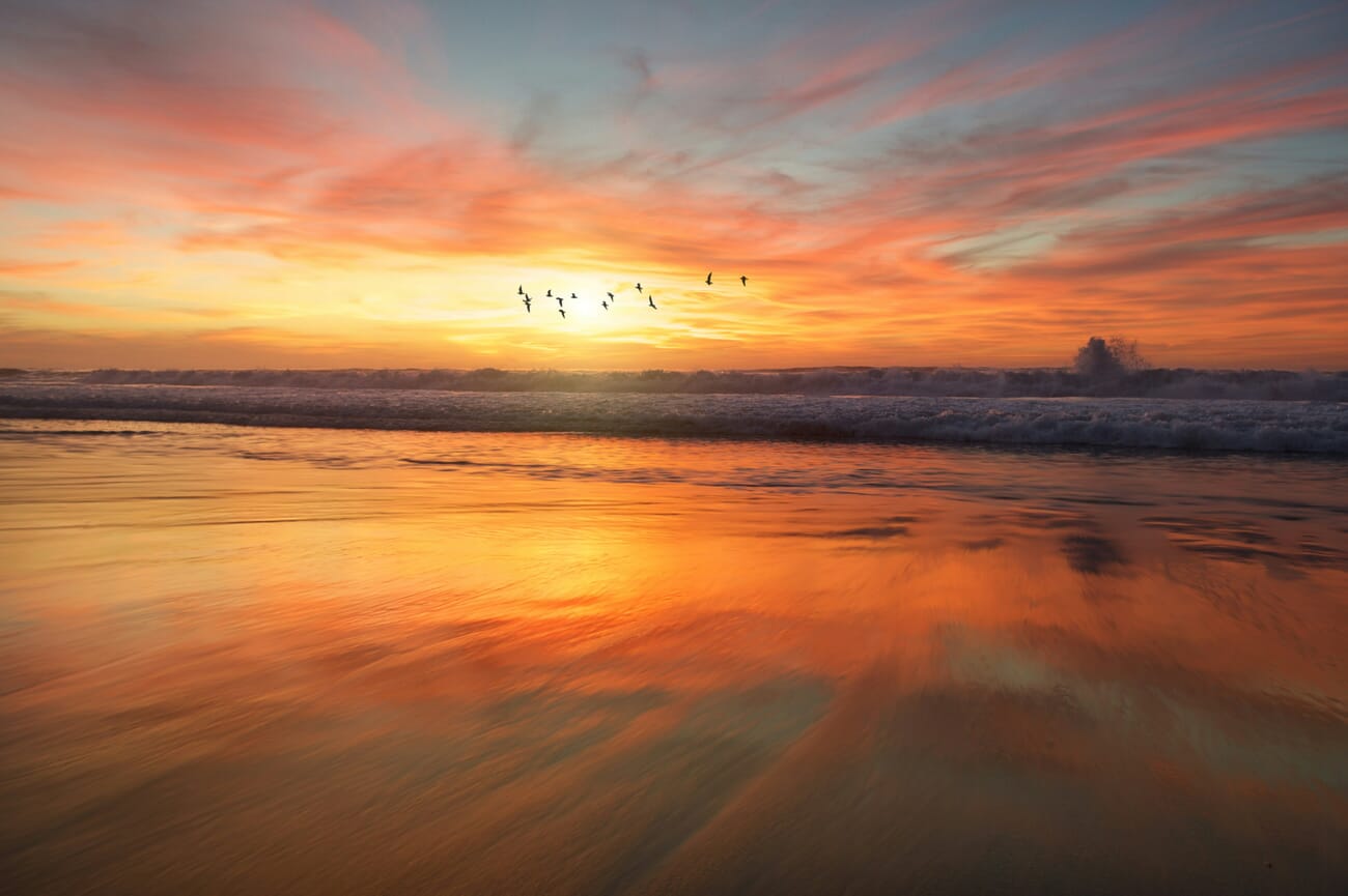 Coastal landscape photograph at sunset showing deep depth of field with everything in sharp focus
