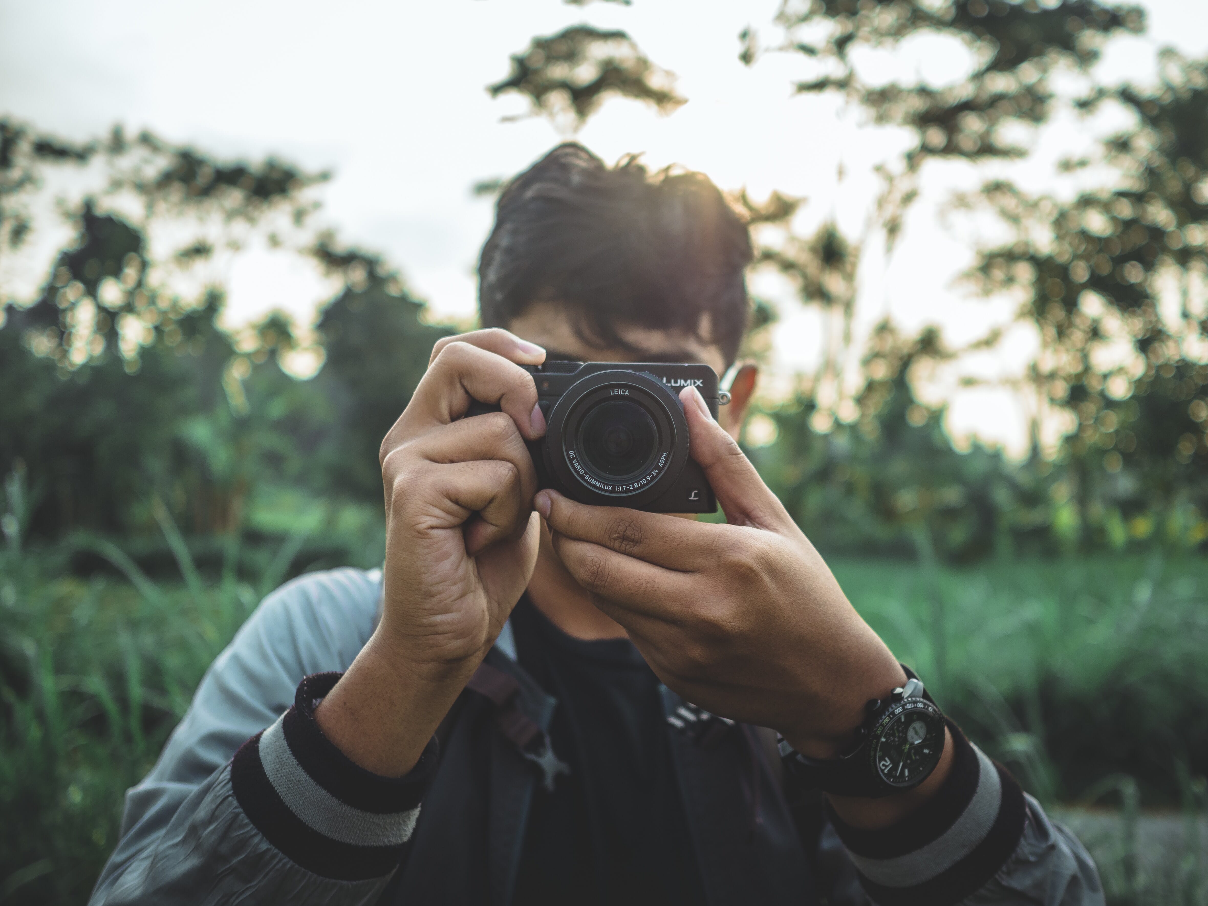 Person with point and shoot camera
