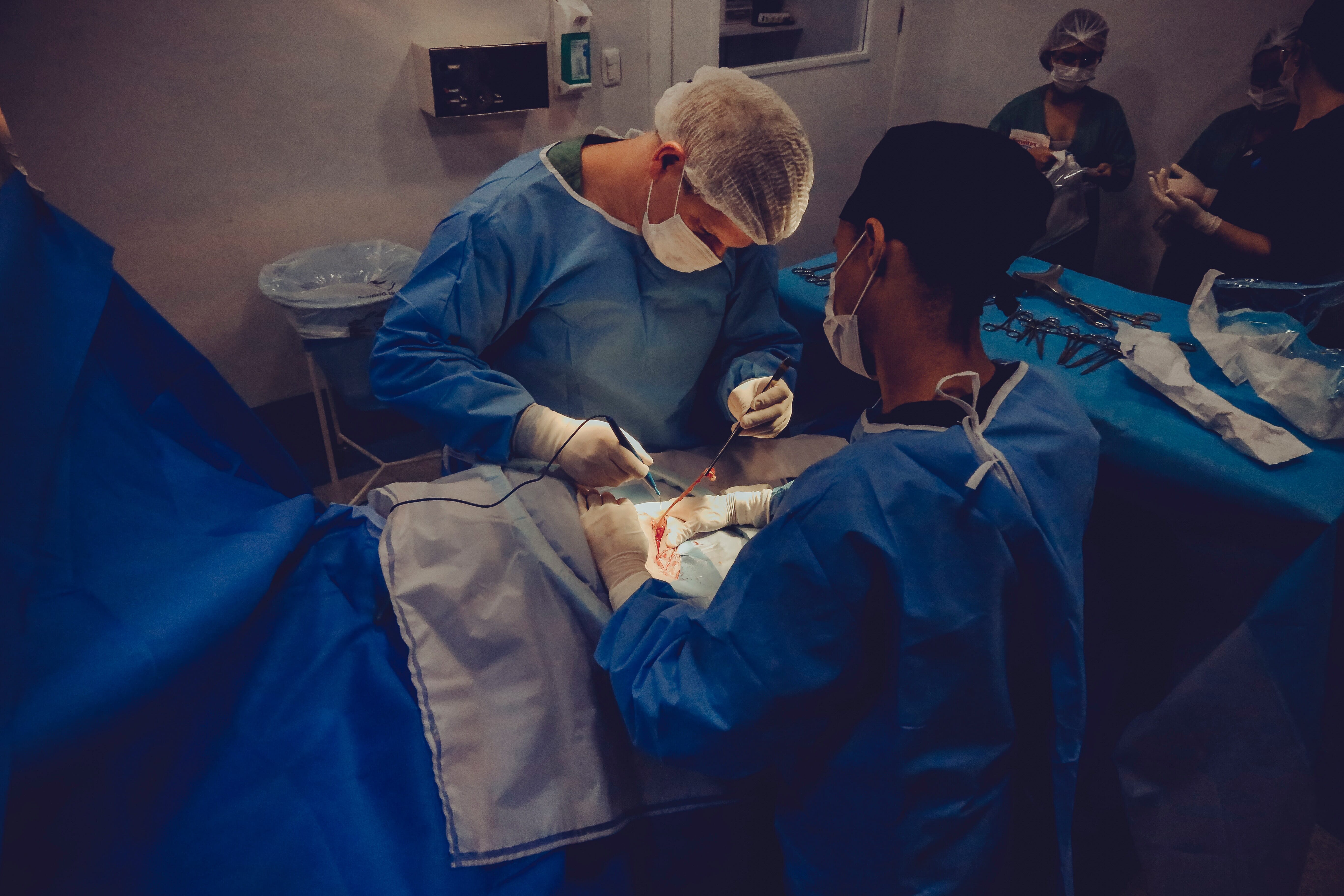 Medical photographers work alongside nurses and doctors, documenting procedures.