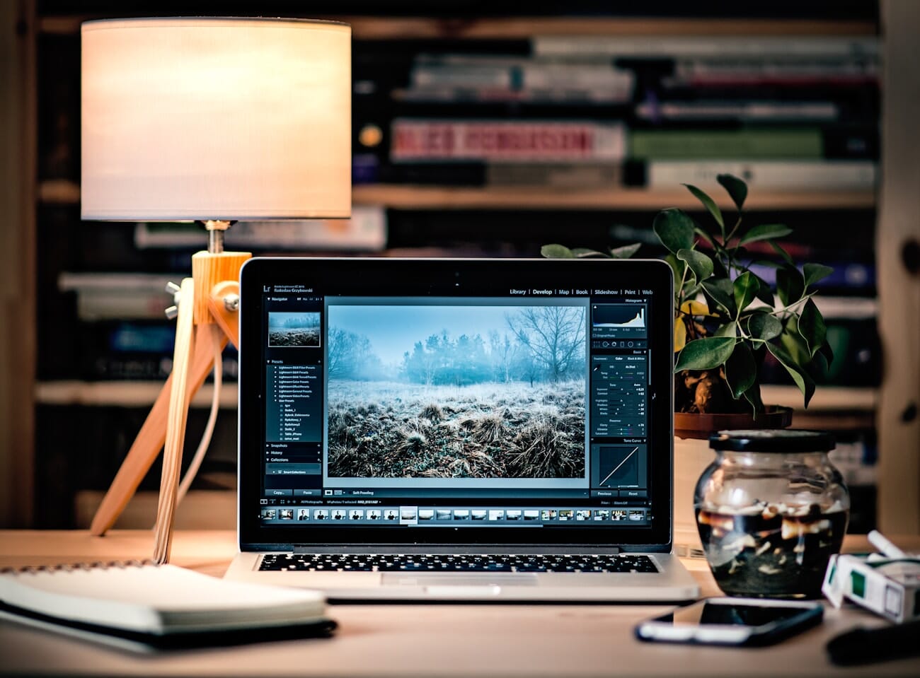 Photographer editing photos on a laptop