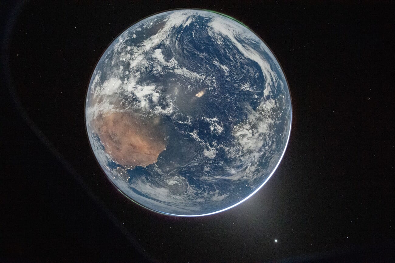 Full Earth portrait from Artemis II showing Africa, aurora, and zodiacal light
