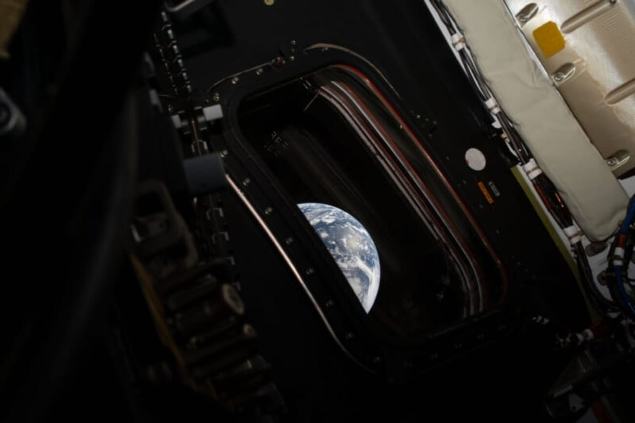 Earth visible through the Artemis II Orion spacecraft window
