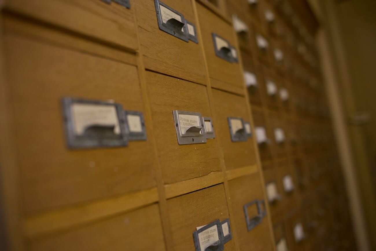 Wooden card catalog drawers with labels showing systematic organization