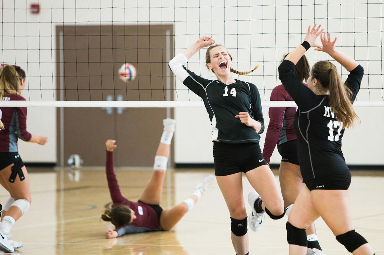 Indoor volleyball action frozen with fast shutter speed