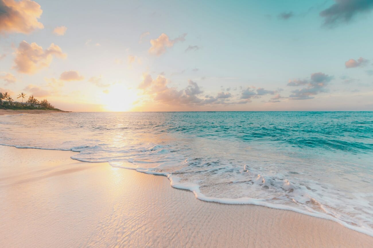 Golden orange sunset over a teal blue sea, a natural complementary color scheme of orange and blue
