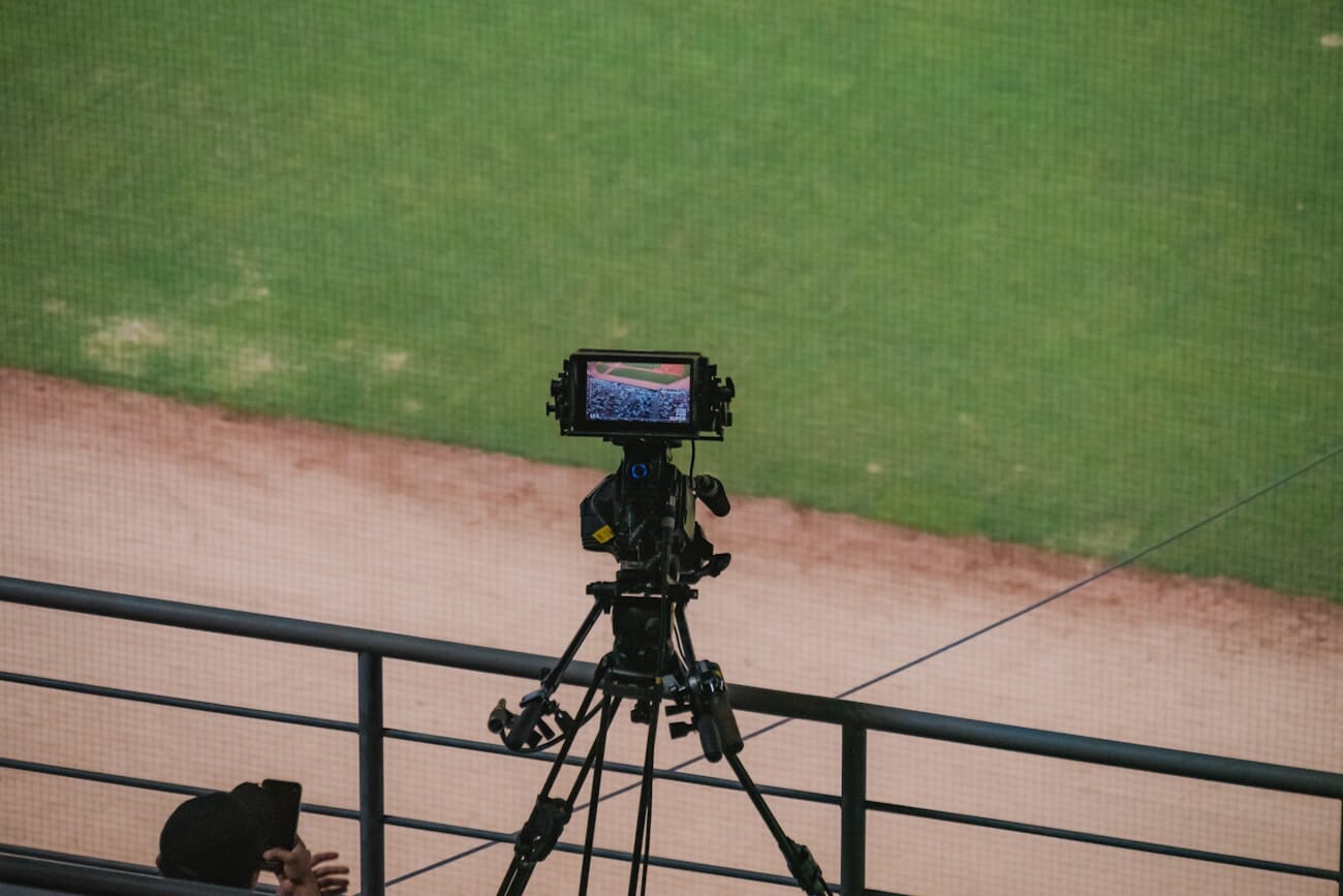 Professional camera mounted on tripod at a major sporting event