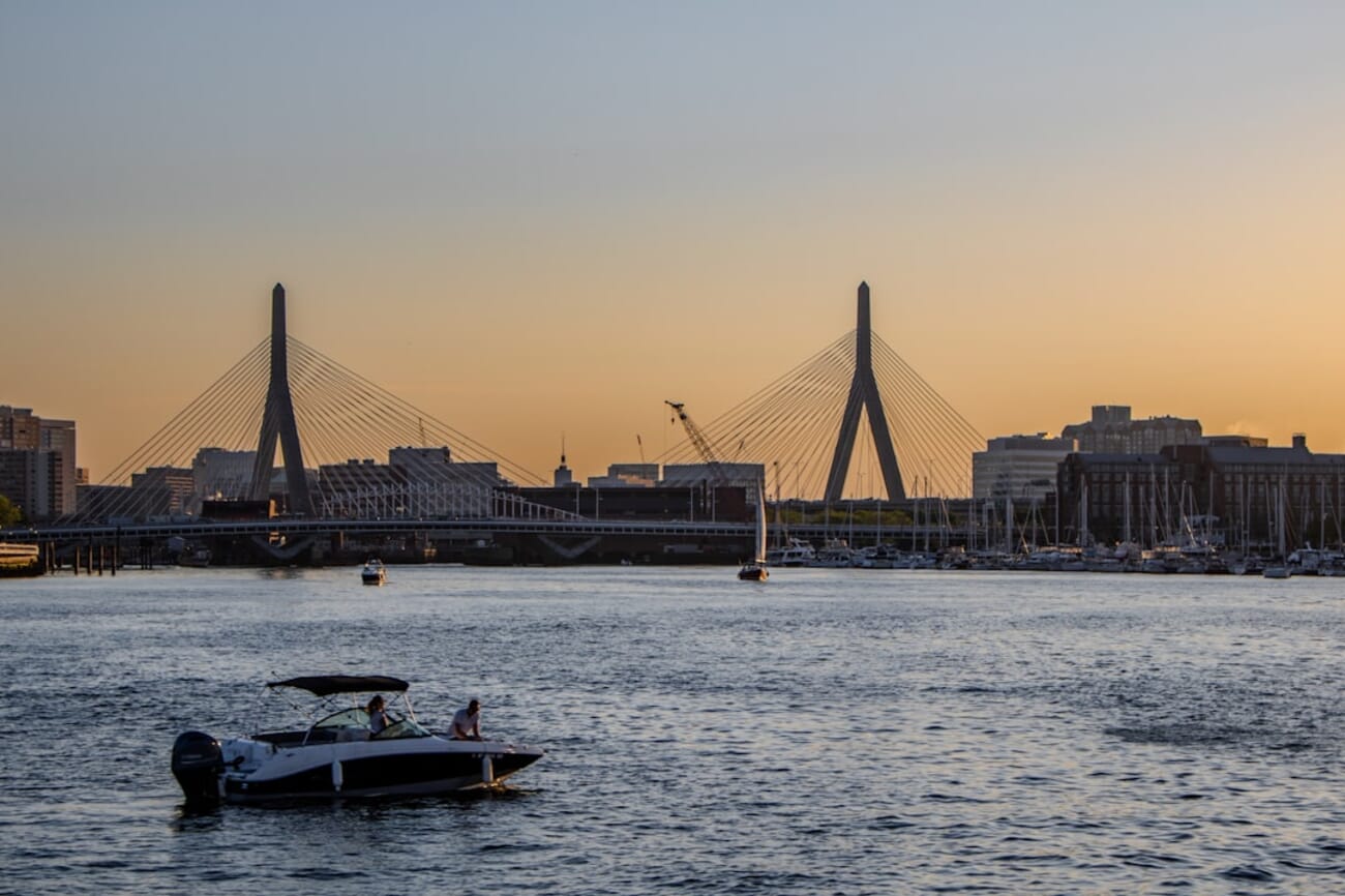 Bridge stretching diagonally across a river at twilight