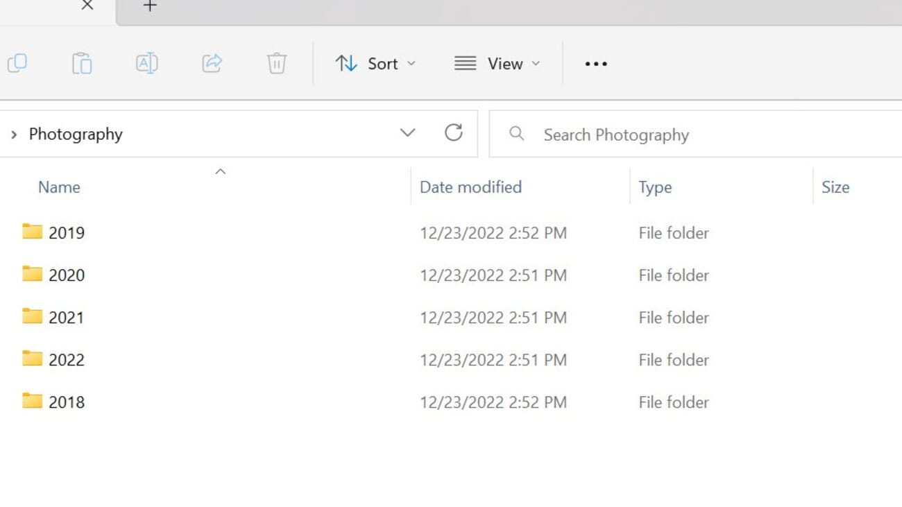 Desktop folder view showing a Photography parent folder containing subfolders for each year 2018 through 2022