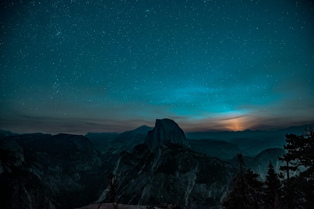 The Milky Way glowing over a granite ridge