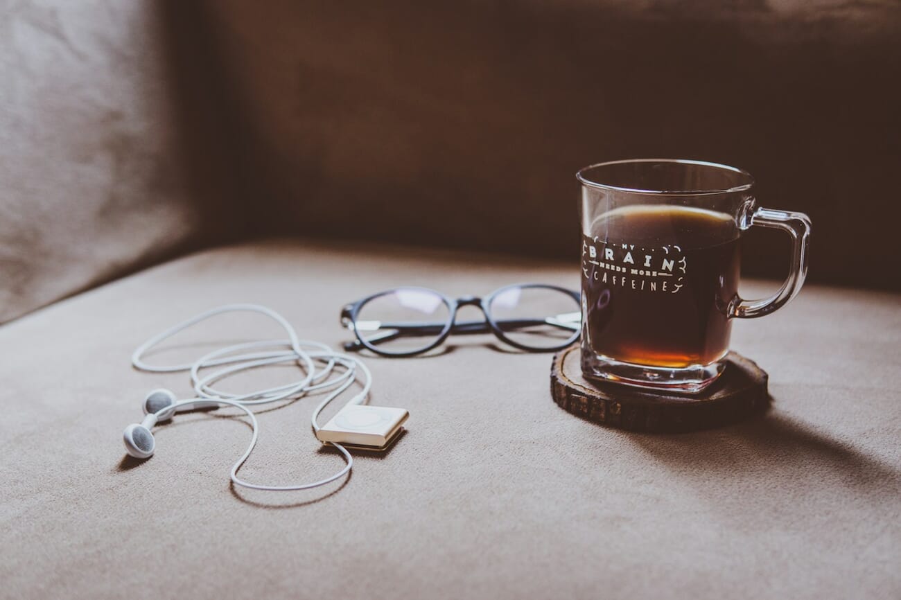 Moody flat-lay food still-life photograph with coffee cup on a dark wooden table