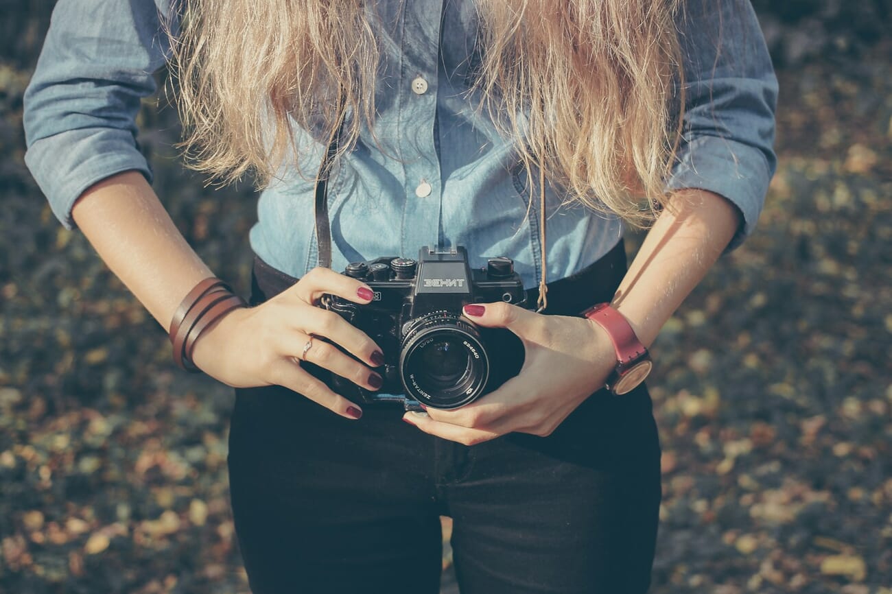 Still life photograph of a vintage camera with warm moody lighting