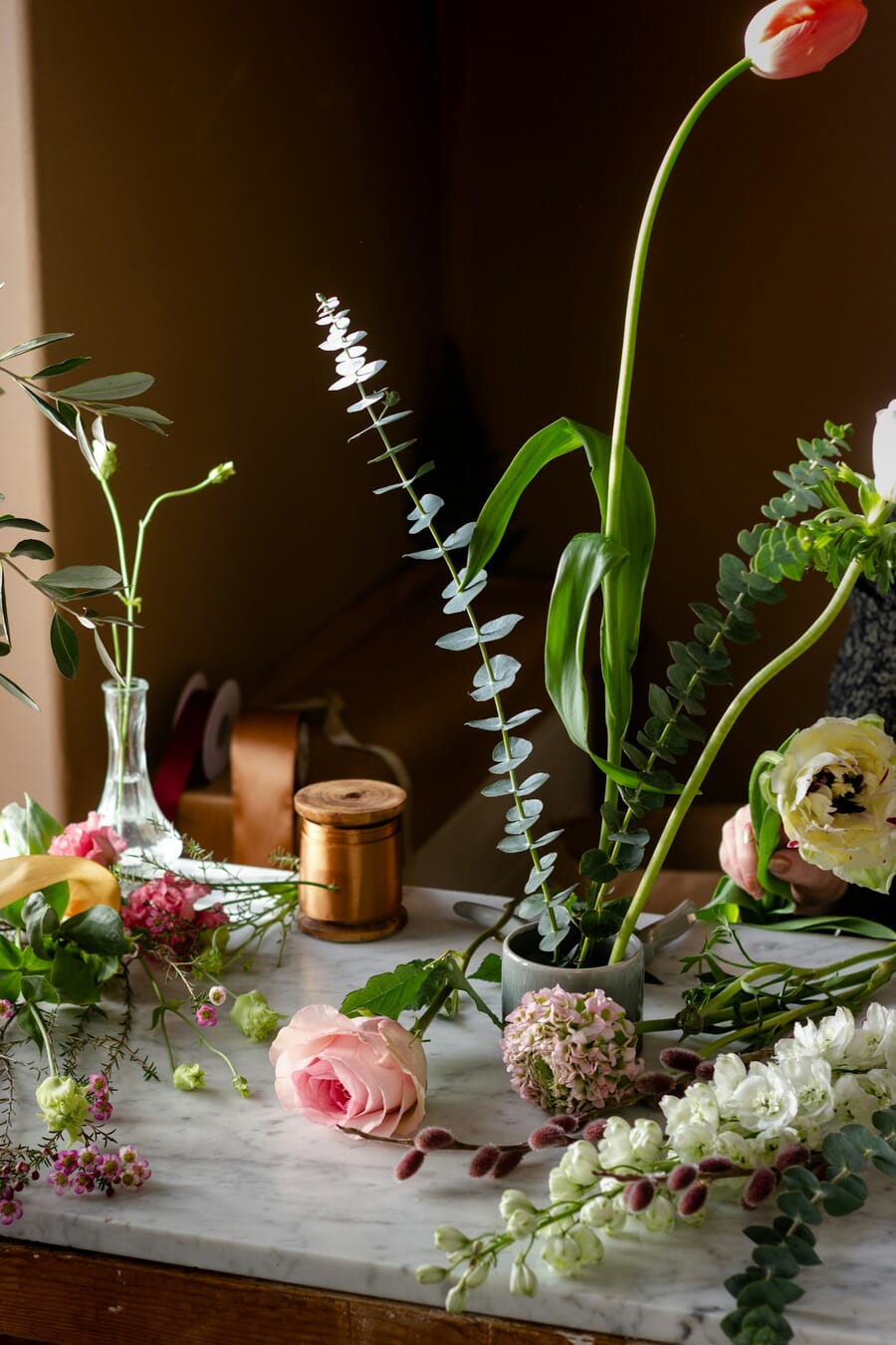Indoor flower arrangement in a vase photographed with natural window light