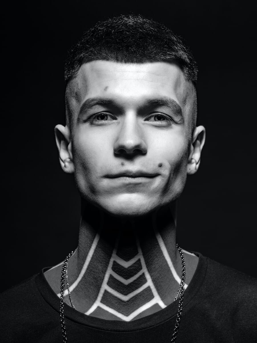 Portrait with split lighting showing half the face in shadow