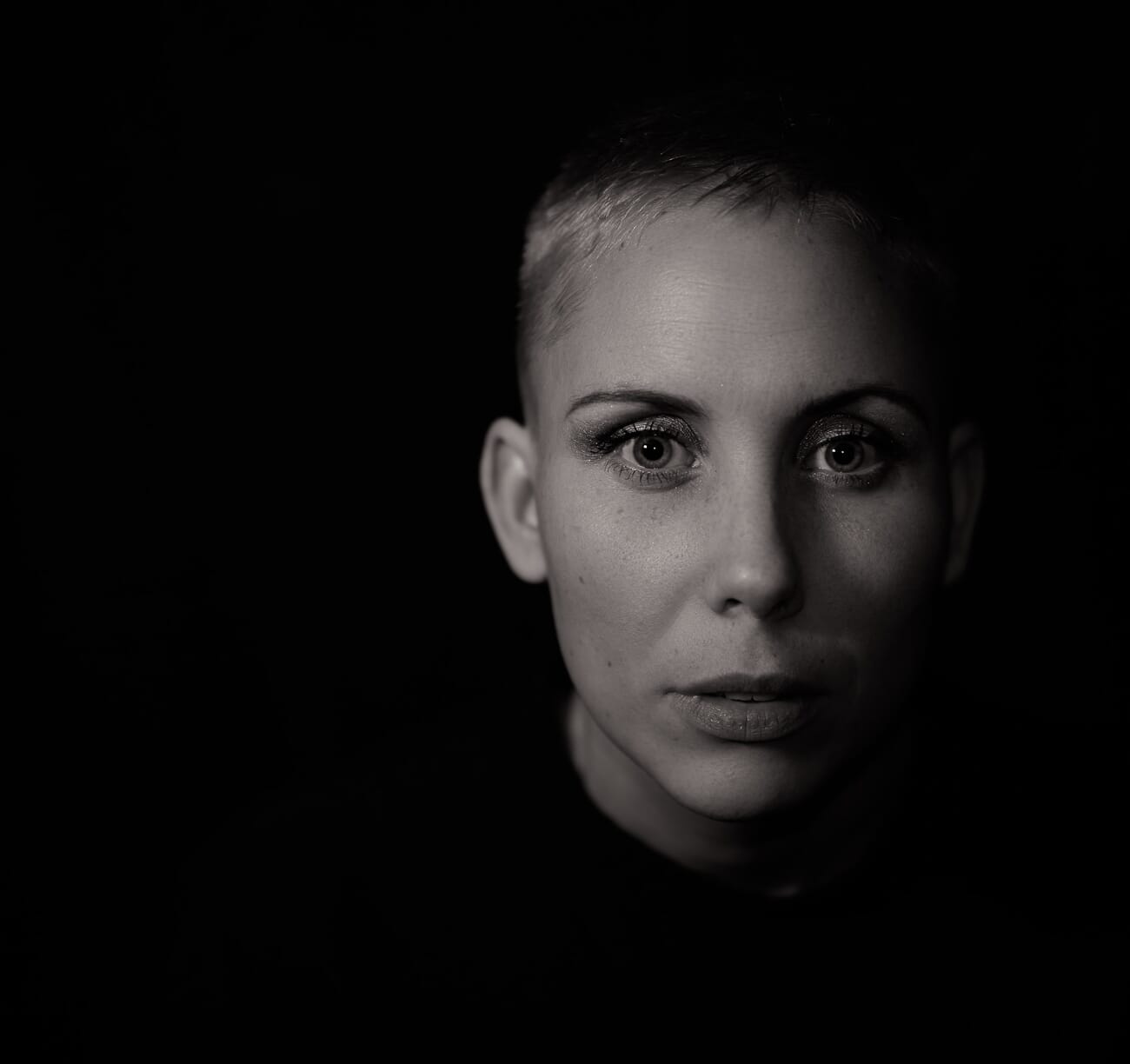 Woman portrait showing Rembrandt lighting triangle pattern