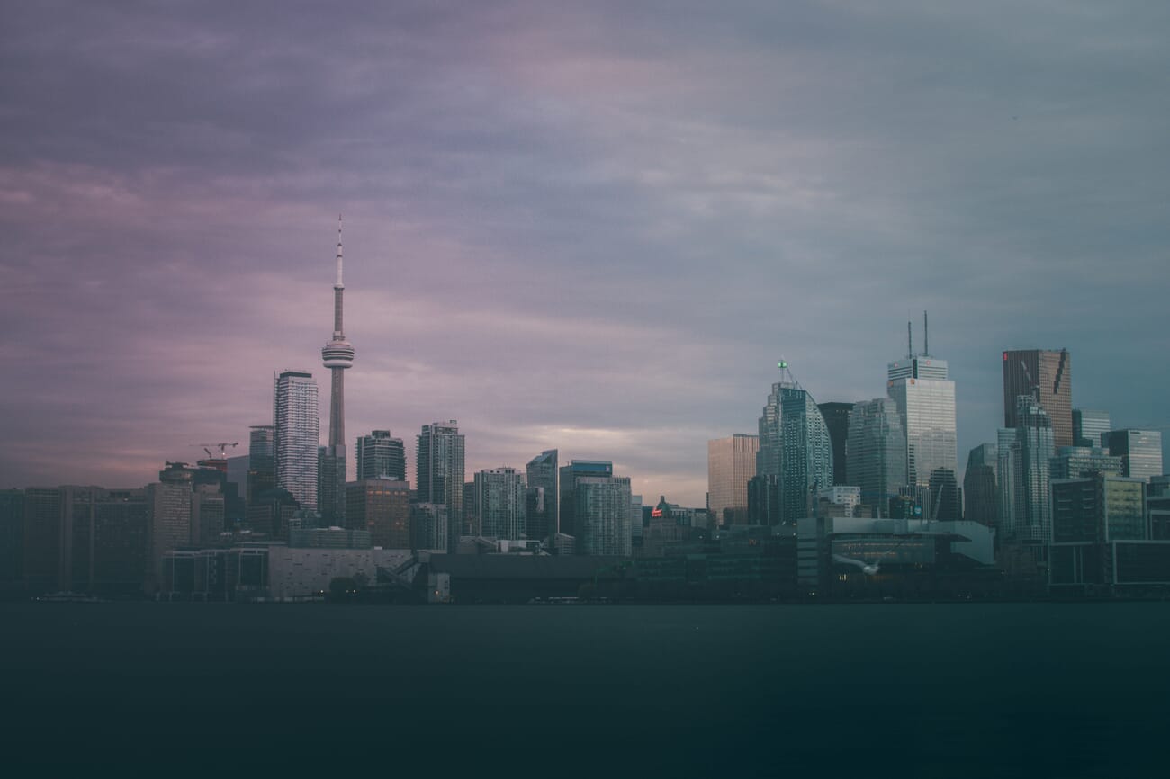 urban skyline at blue hour — Blue-hour Skyline: CN Tower Anchoring a Quiet Toronto Harbor
