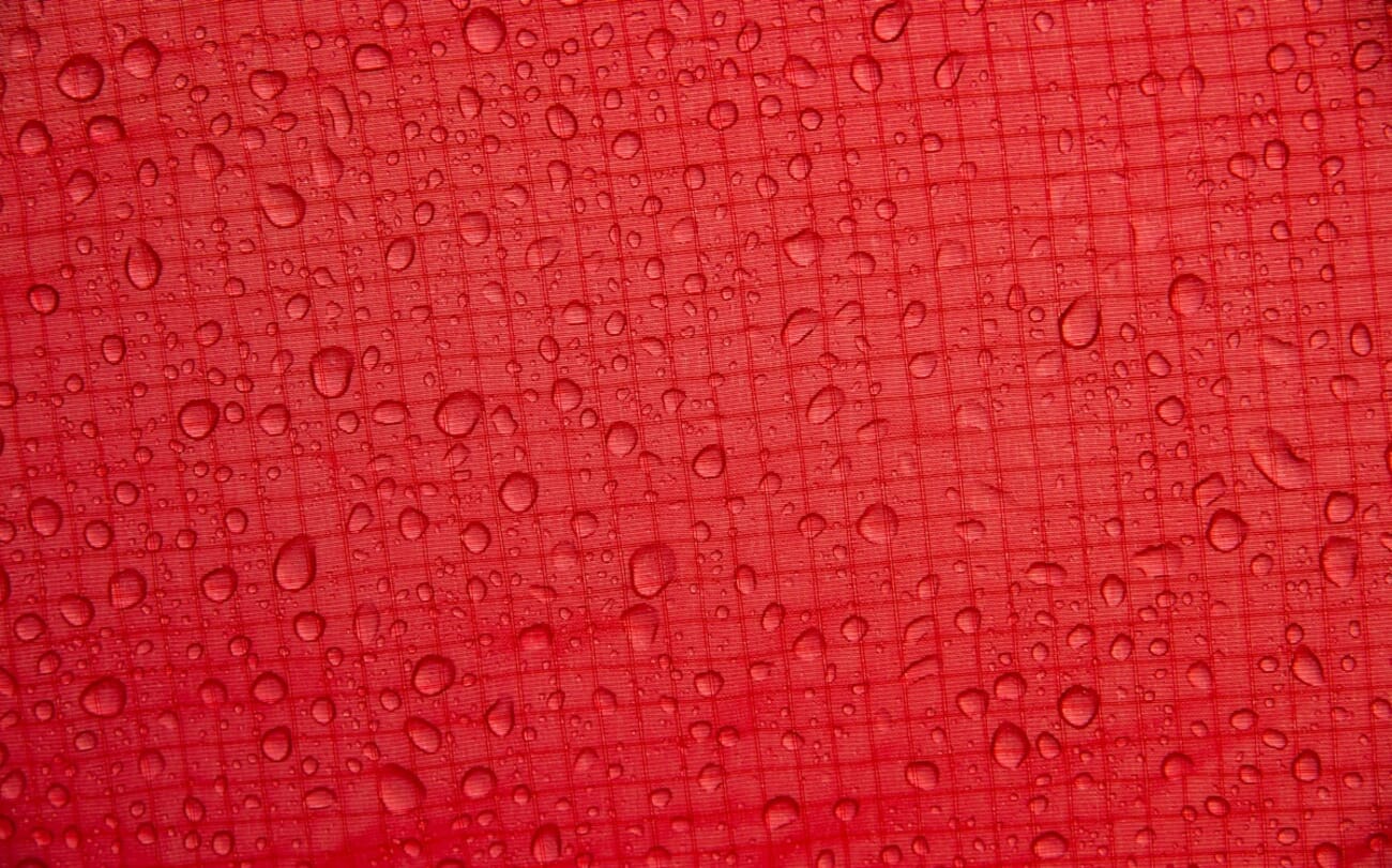 Droplets on Crimson Canvas