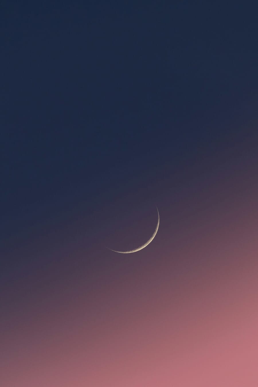 Crescent moon photographed with Nikon Z5 II and telephoto lens showing fine lunar detail