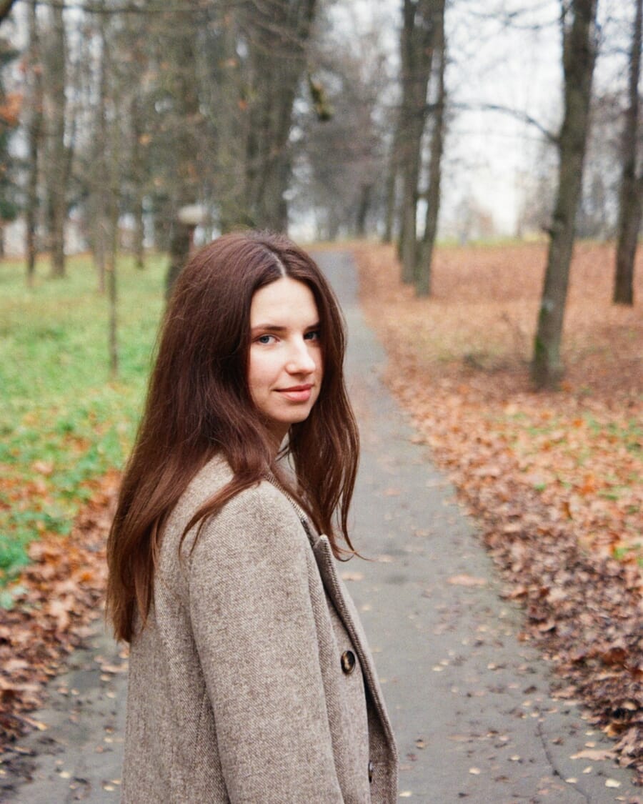 Woman walking on autumn park path — shot on Minolta Dynax 303si