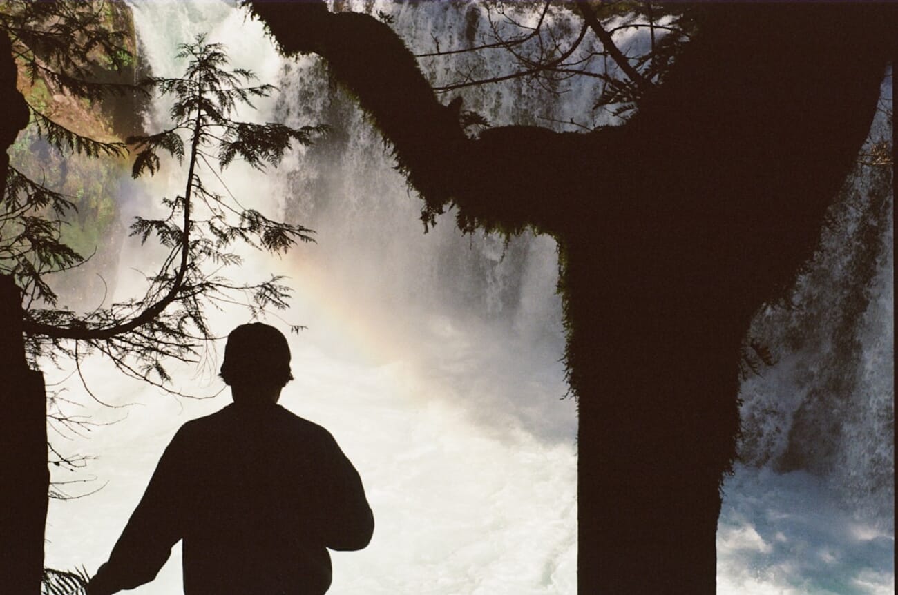 Silhouette near a powerful waterfall — shot on Minolta X-370