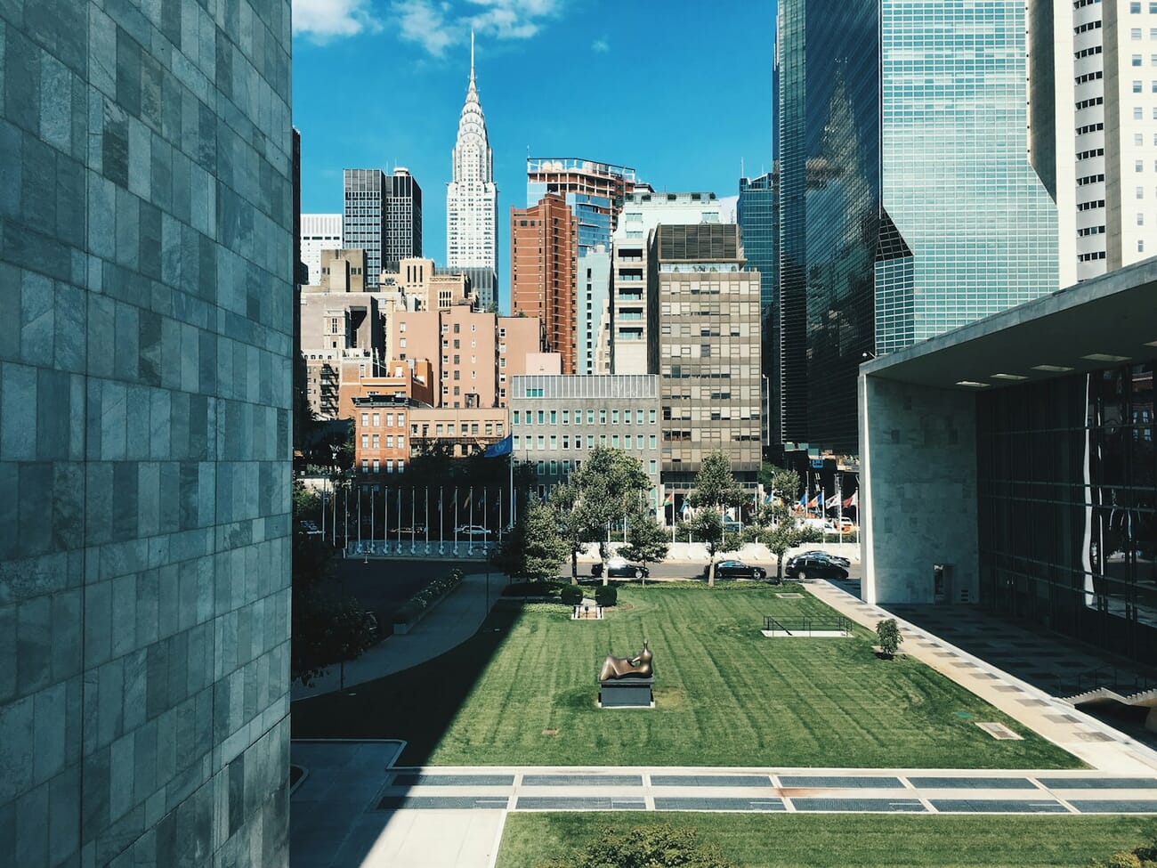 A green Midtown Manhattan lawn with the Chrysler Building and skyline behind it