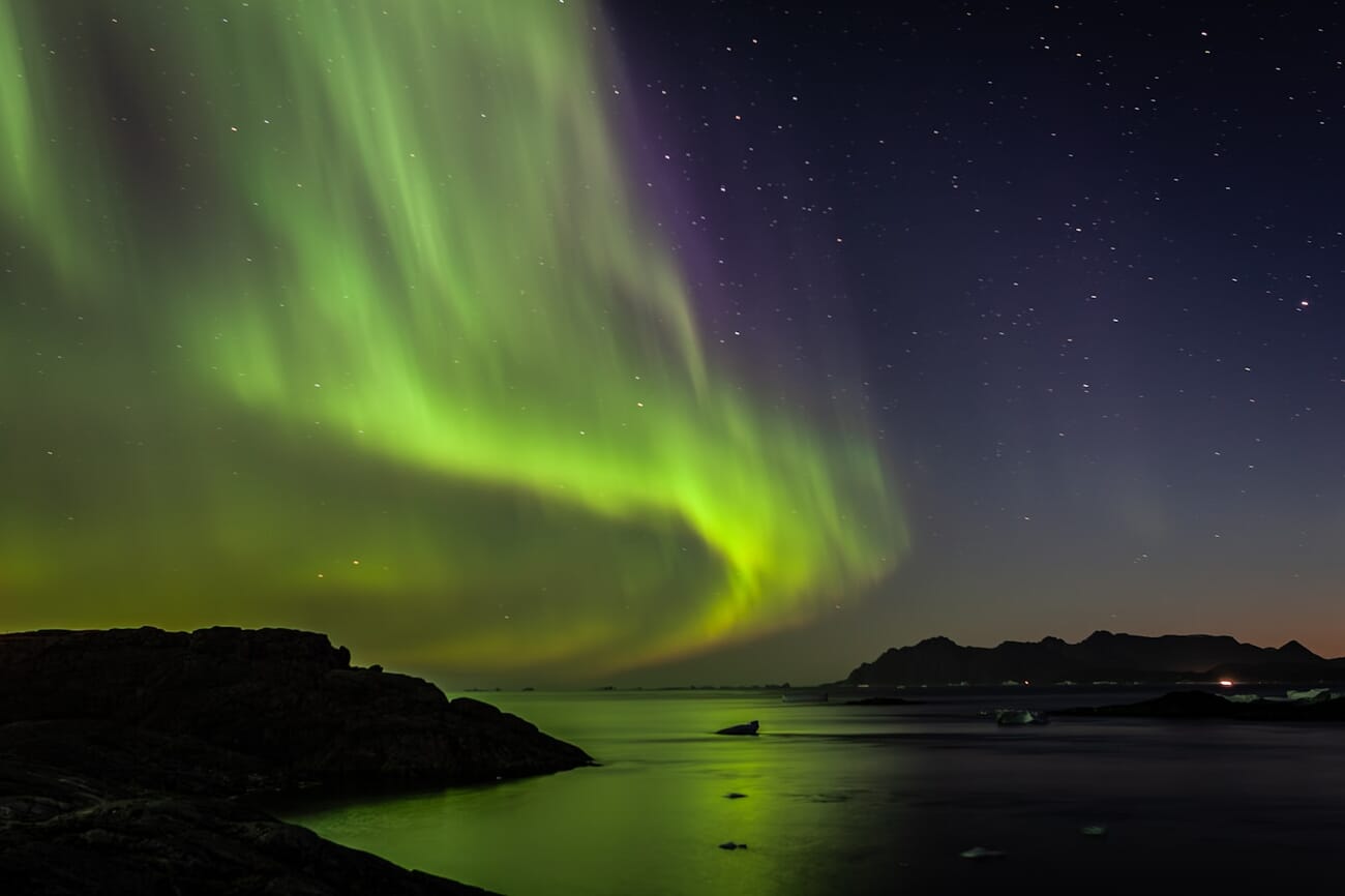 Northern Lights aurora borealis over East Greenland fjord shot on Canon EOS-1D Mark II