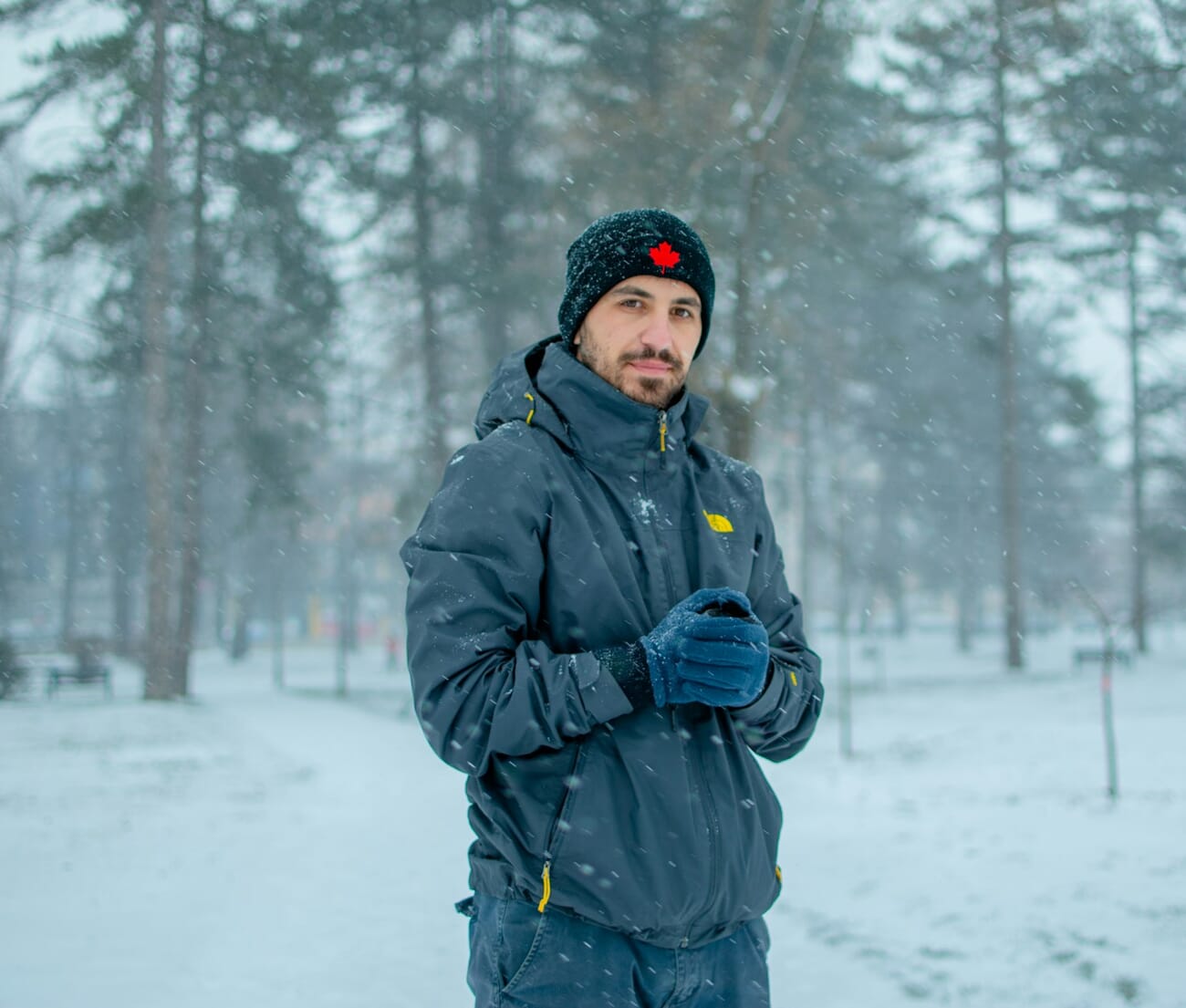 Woman standing in snowy landscape during winter portrait session