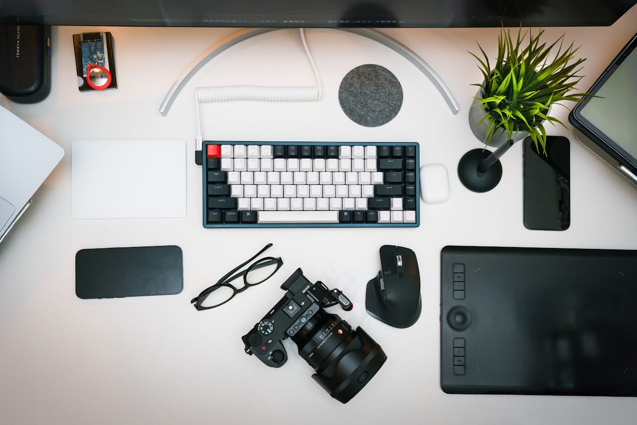 Photography editing workspace with camera and keyboard showing photo editing environment