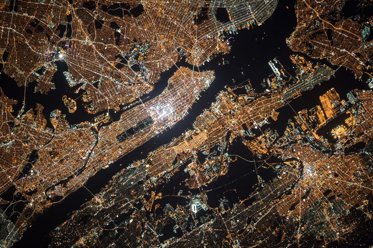 Aerial view of city lights at night showing urban patterns from above