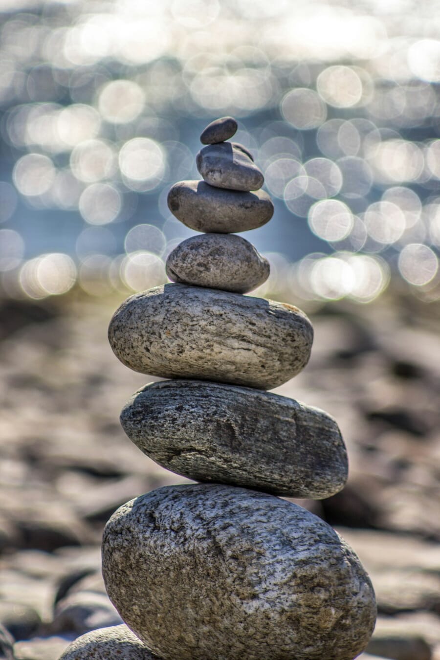 Stacked pebbles with beautiful bokeh background demonstrating shallow depth of field