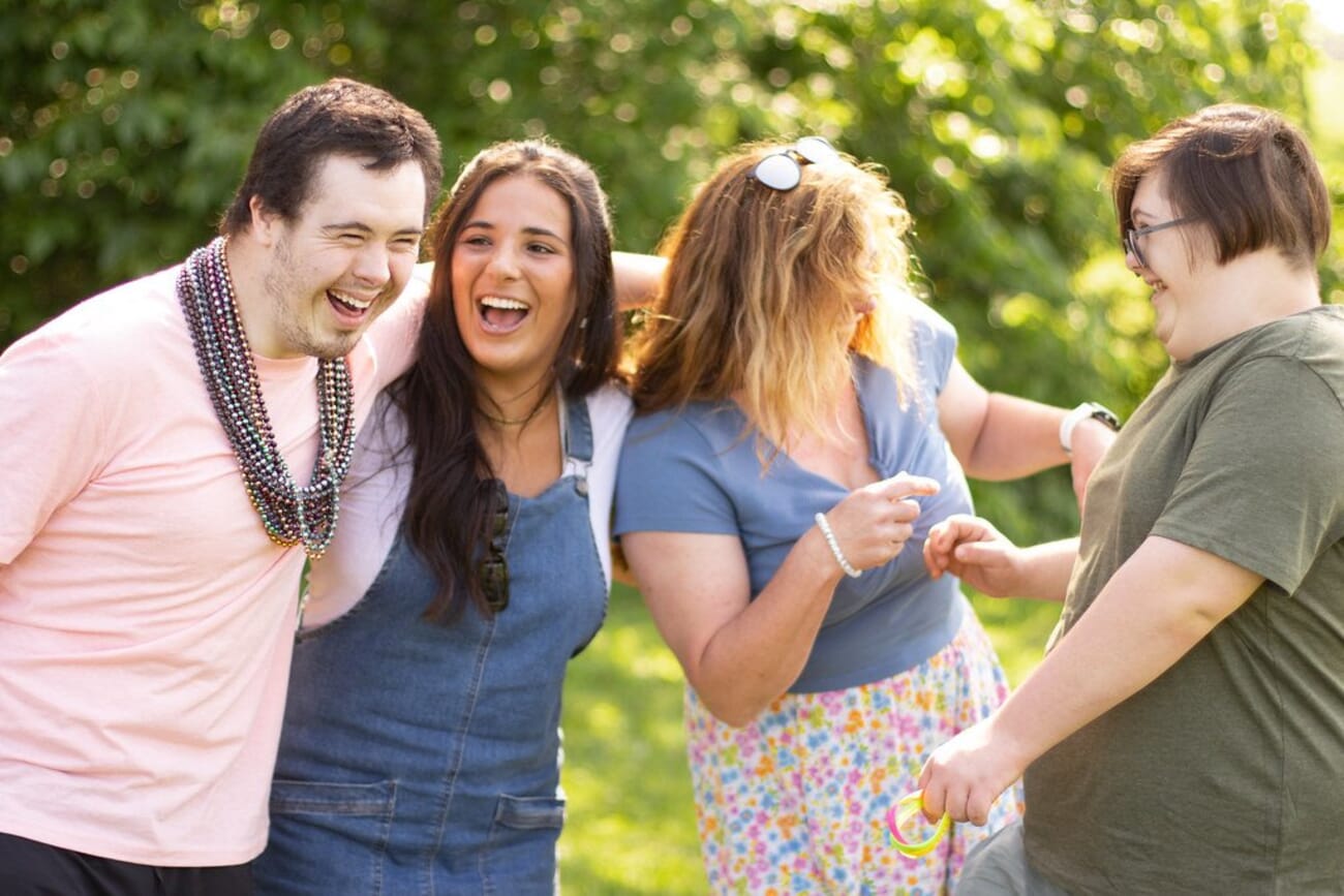 A group of friends laughing together outdoors