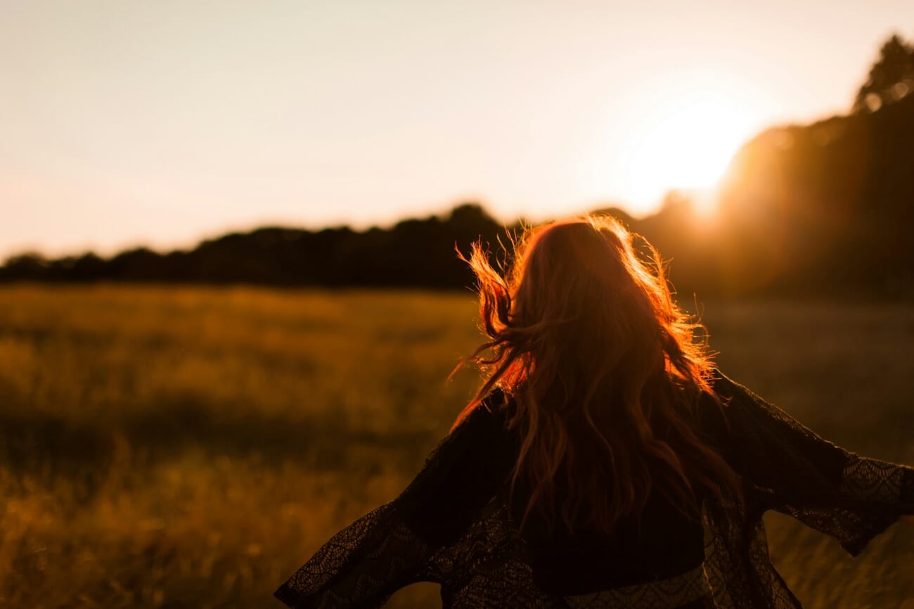 Backlit outdoor portrait during golden hour with warm sunlight