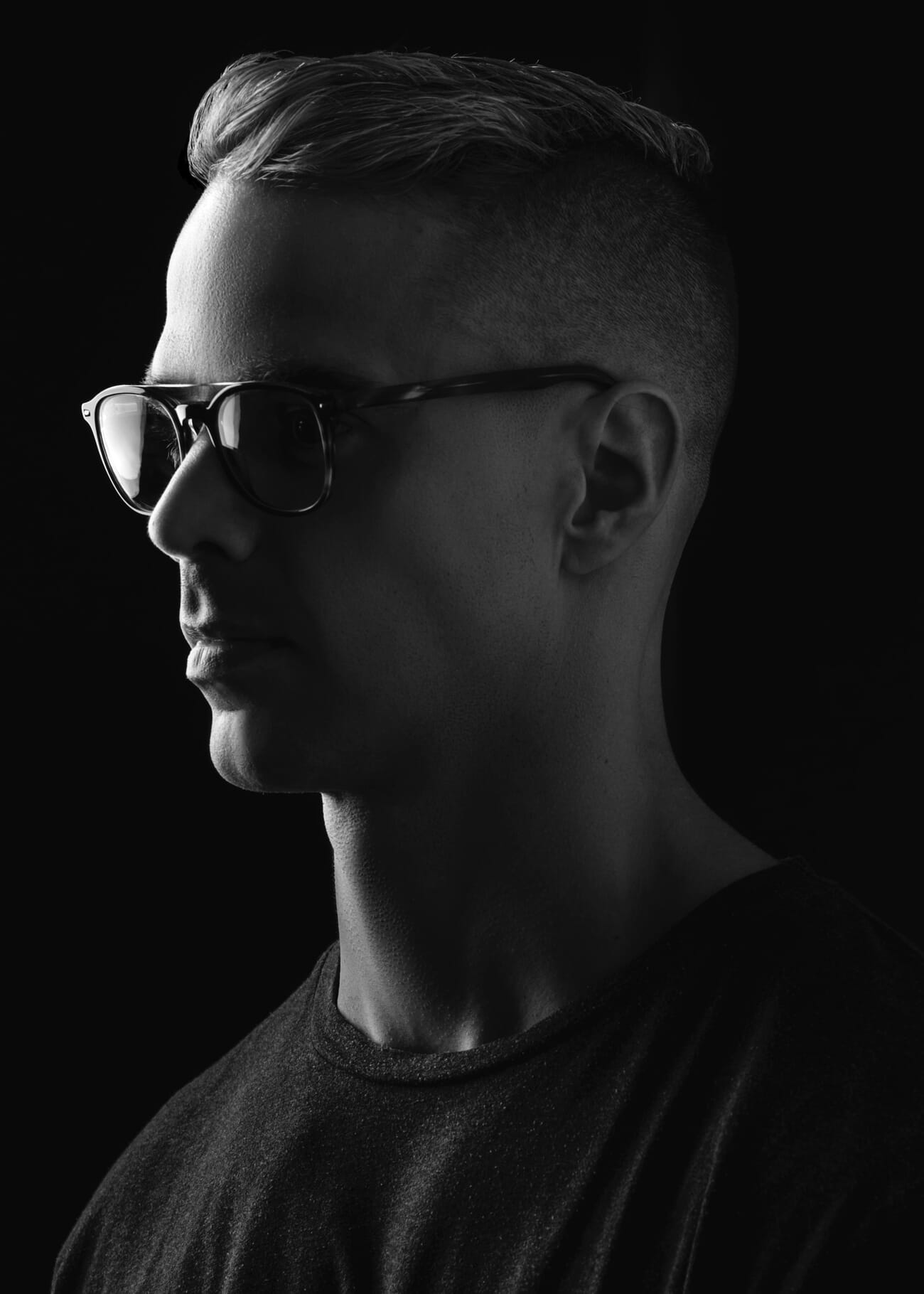 Rim-lit subject against a dark background showing strong contrast