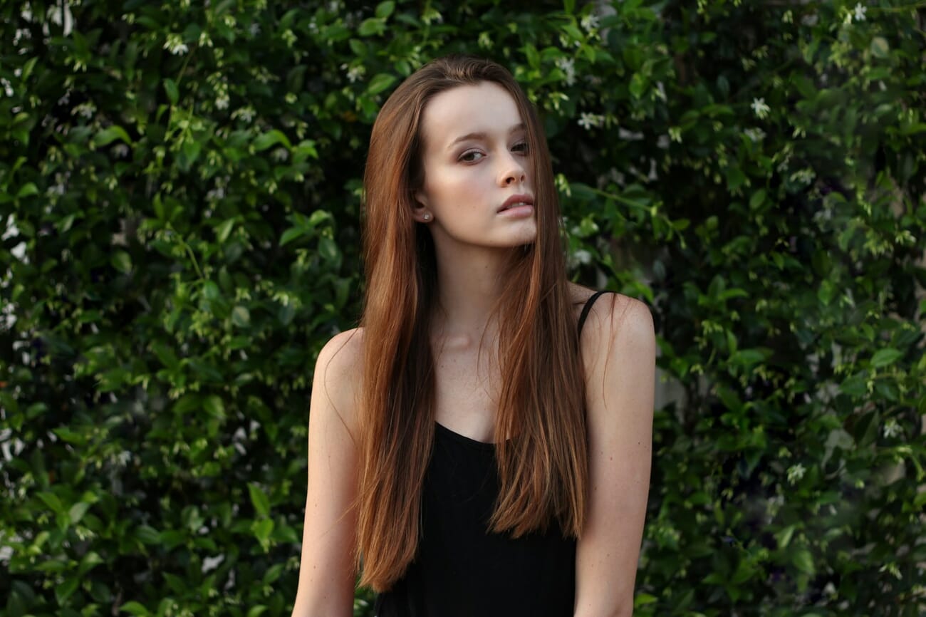 Outdoor portrait demonstrating rule-of-thirds composition with the subject's eyes on the upper third line