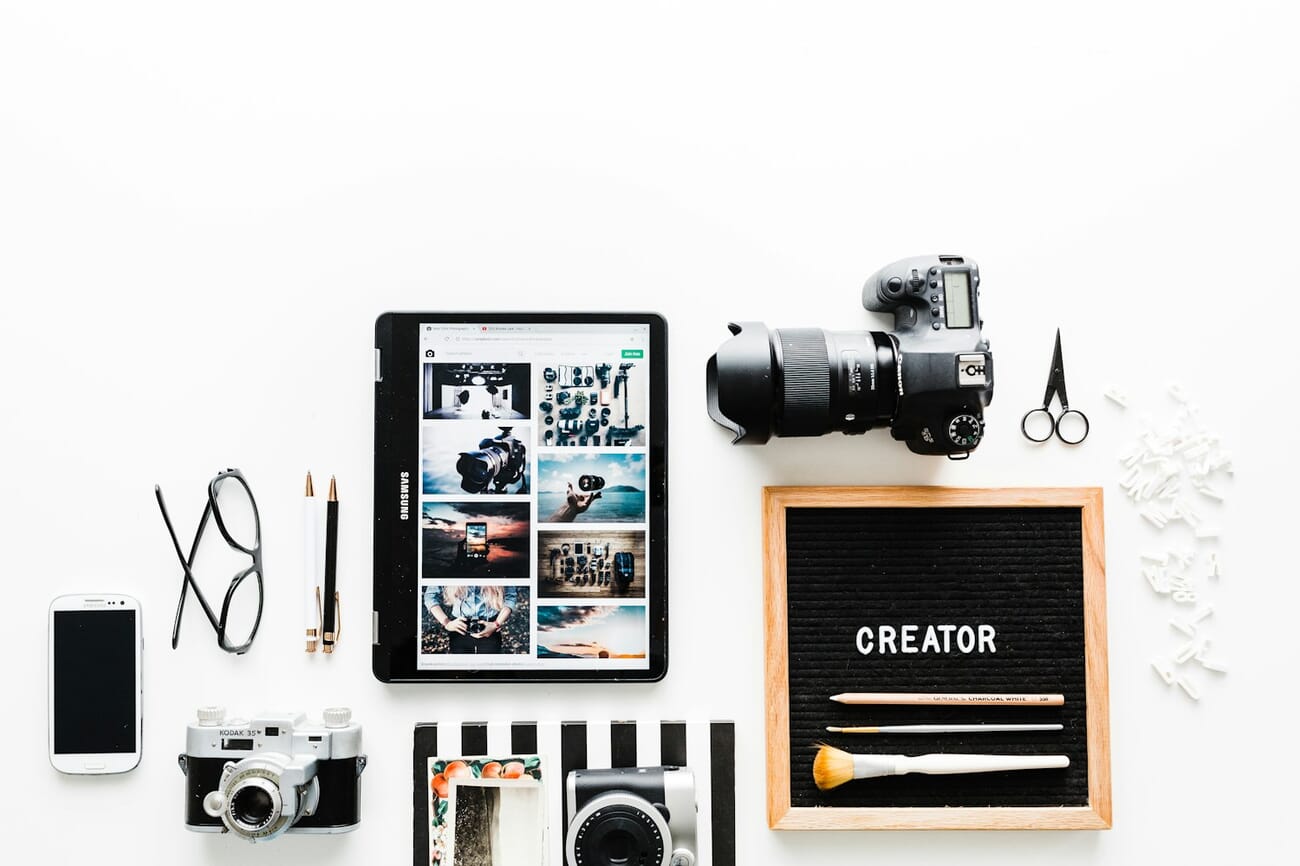 Photographer workspace with camera, laptop, and editing equipment for stock photography