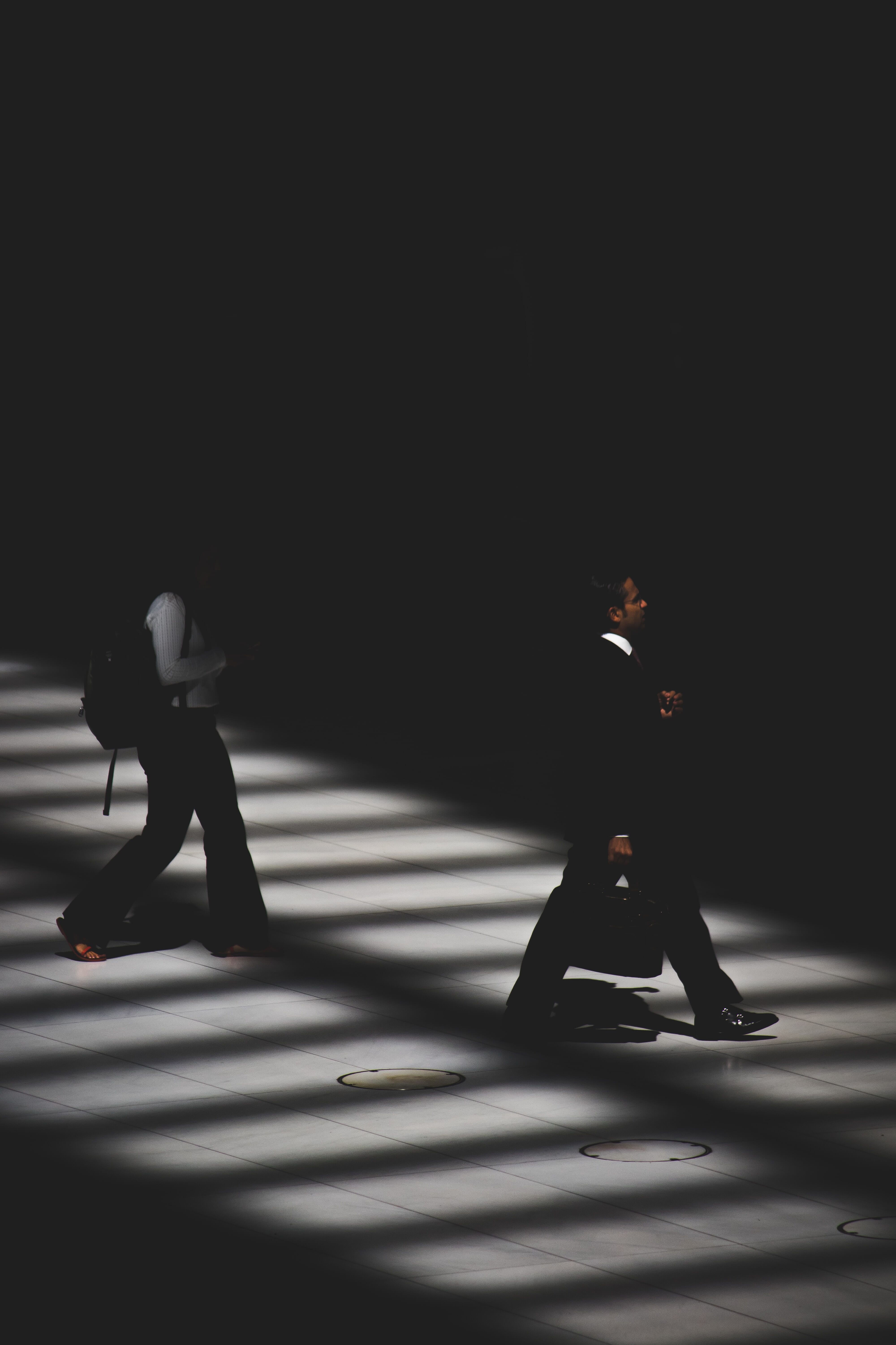 men walking in shadow