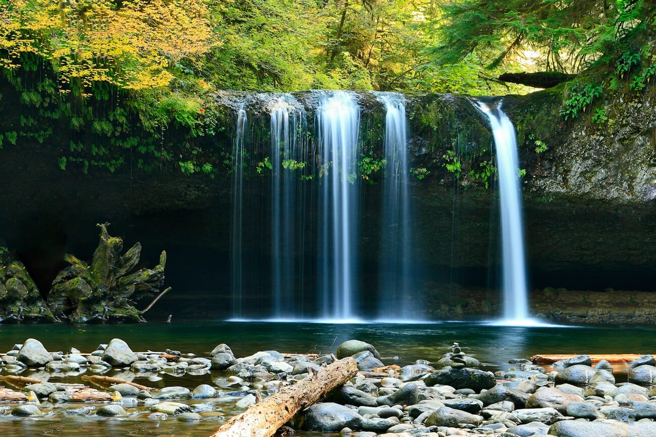 A forest waterfall with silky smooth water, the motion blurred by a two-second exposure, shot at f/20.0 · 2s · ISO 100