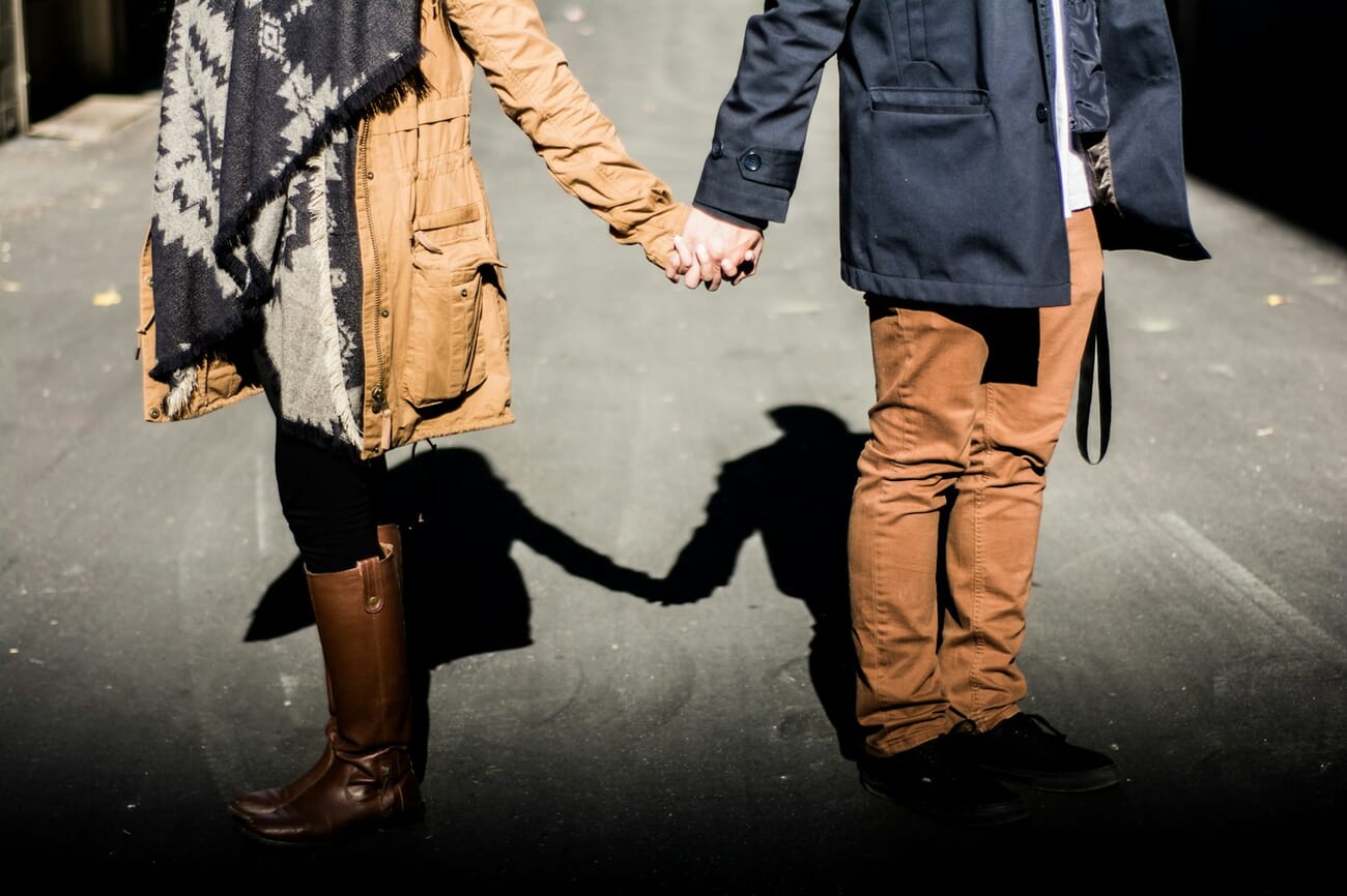 A candid street scene in daylight, subject sharp and exposure balanced across mixed light and shadow, shot at f/1.8 · 1/1600 · ISO 100