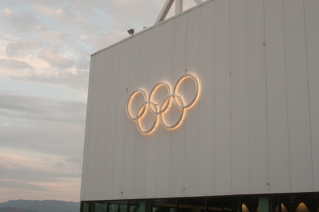 Building with illuminated Olympic rings at Milano Cortina 2026