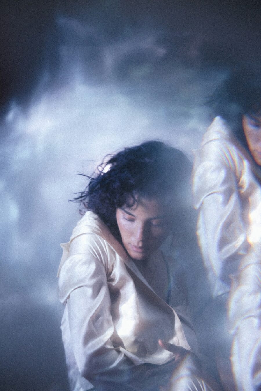 Portrait shot through a prism creating rainbow light effects and distortion