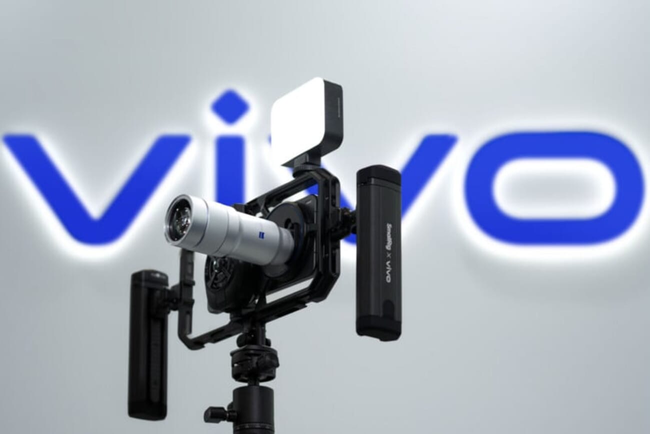 Vivo X300 Ultra with camera rig and ZEISS teleconverter lens attached