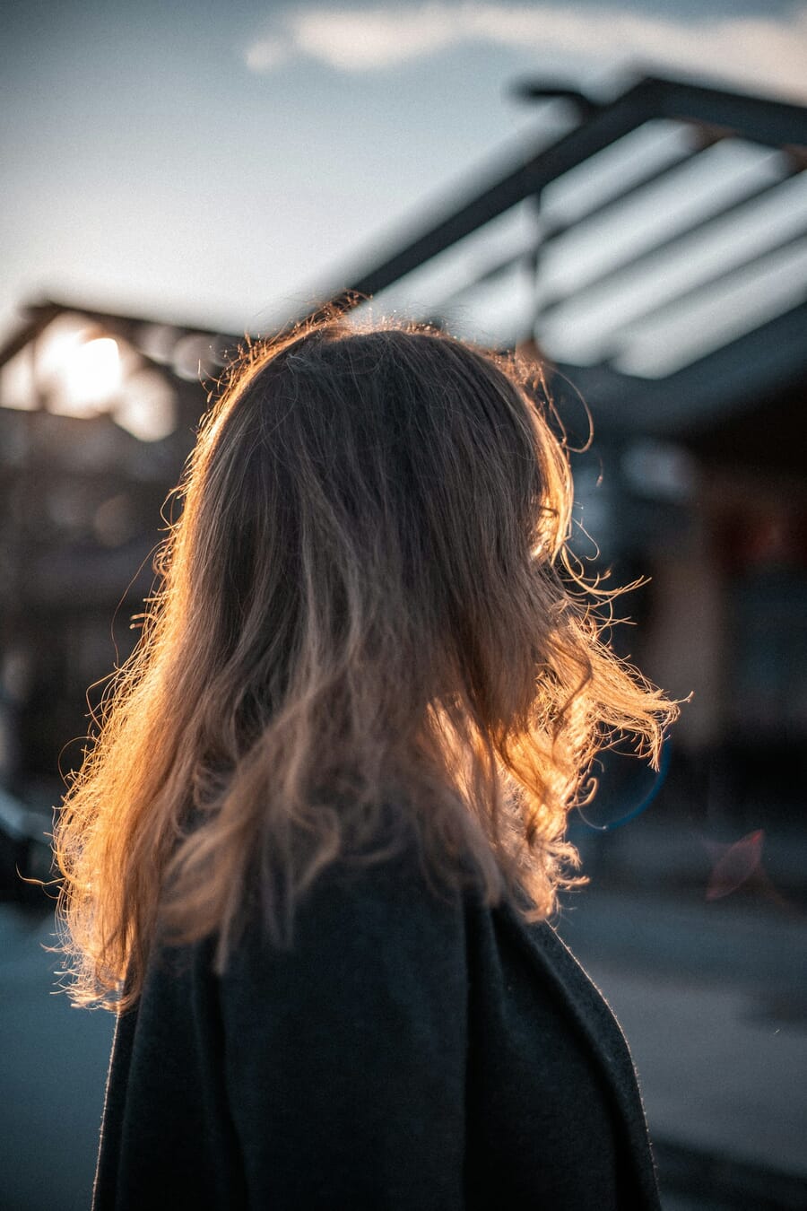 Backlit portrait with rim light from a window creating a halo effect
