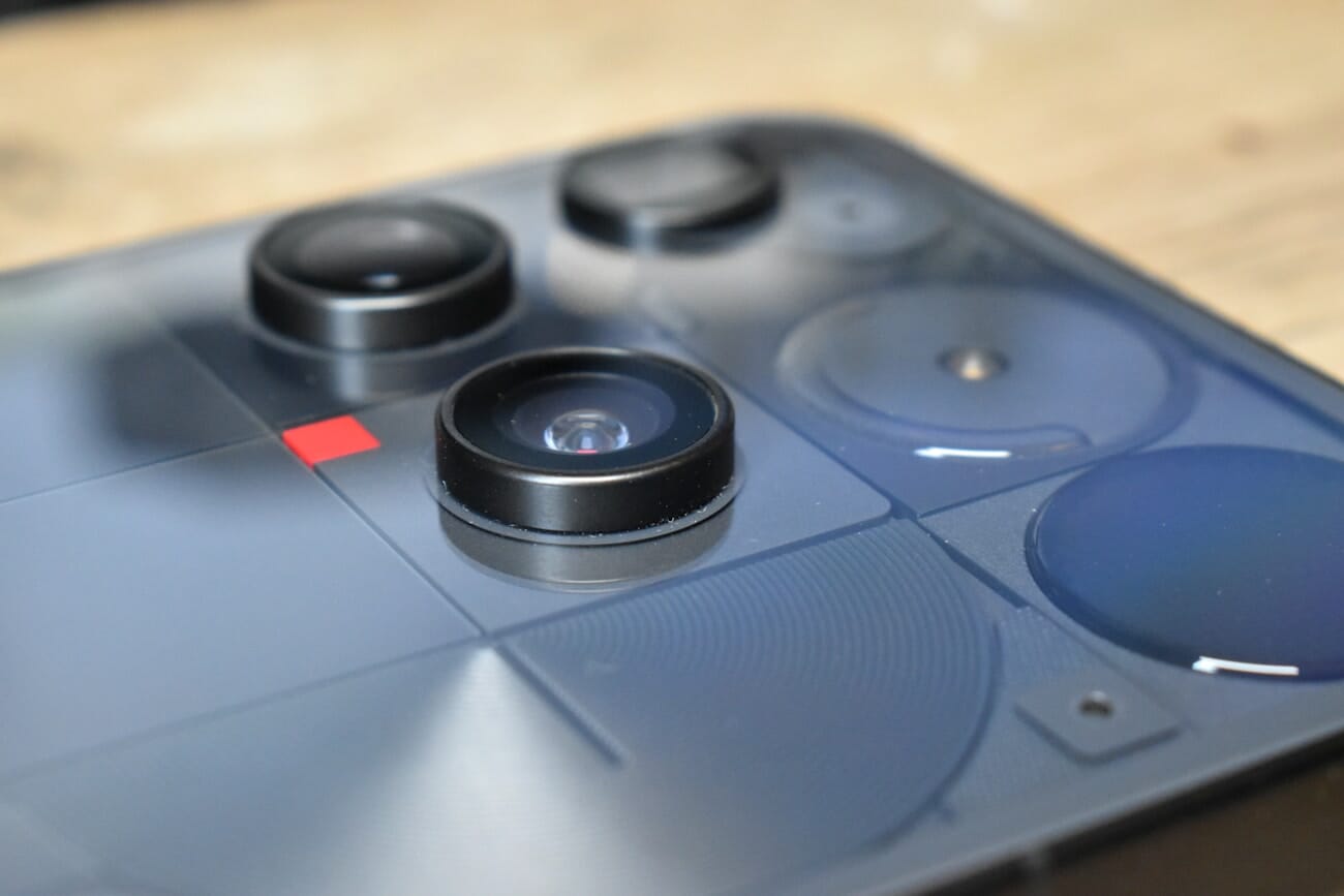 Close-up of a modern smartphone camera lens array showing multiple camera modules