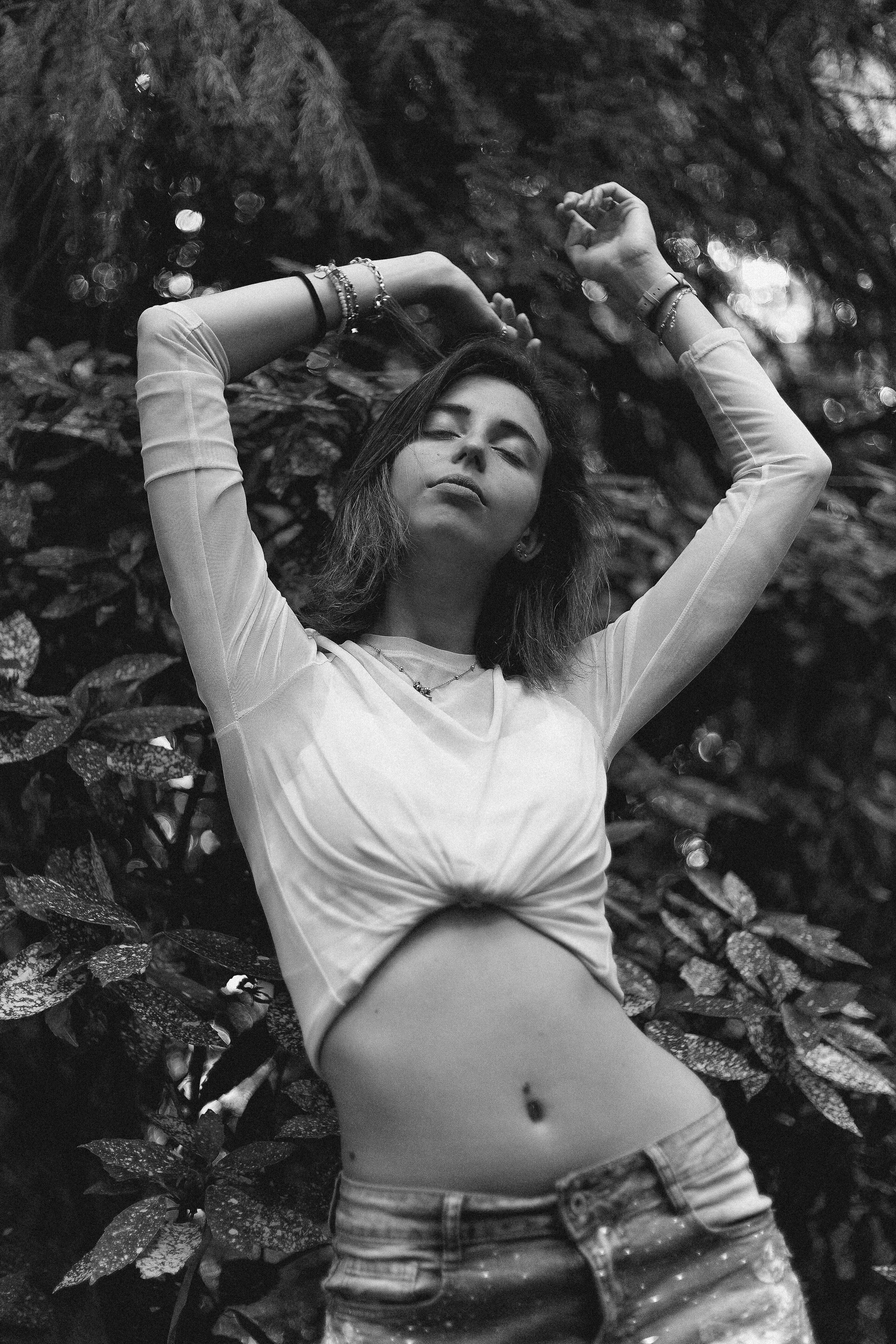 person posing with hands above their head