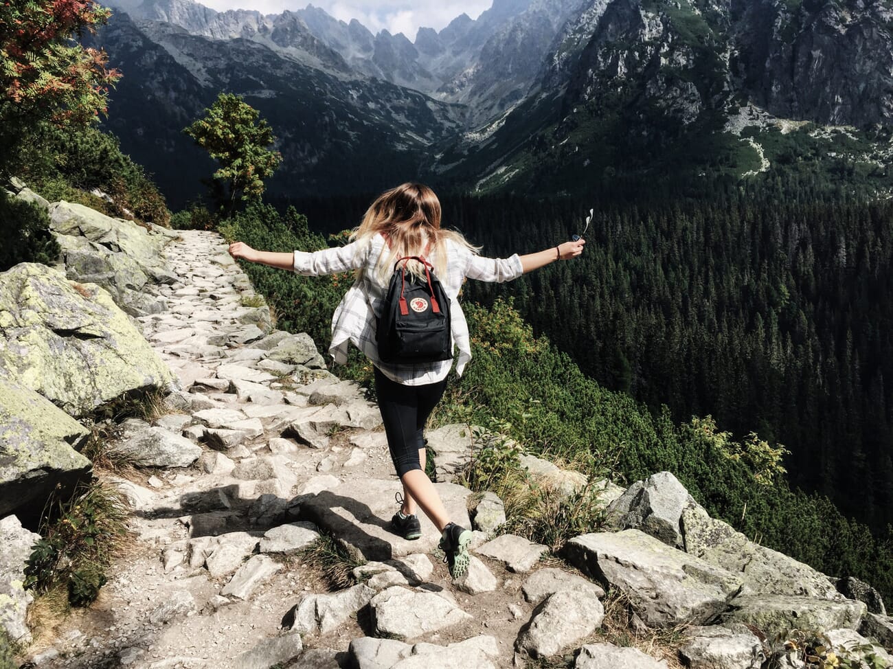 Adventure photography showing subject exploring a dramatic landscape