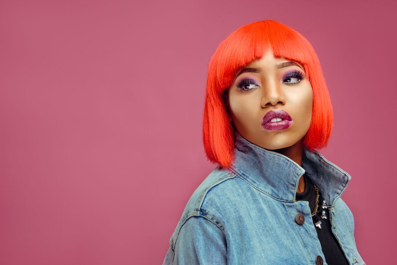 Portrait featuring vivid bold colors in makeup and backdrop
