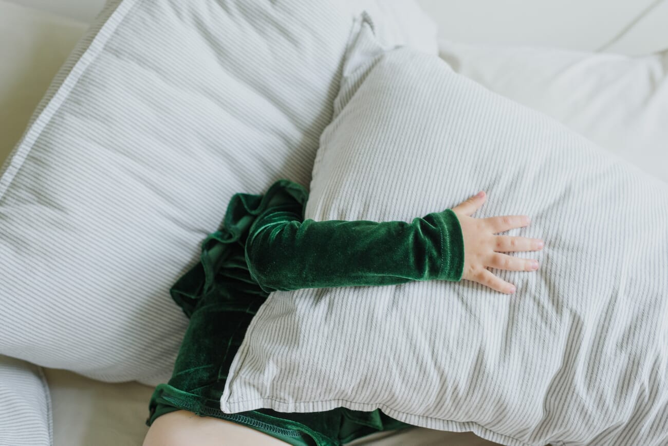 Cozy at-home lifestyle portrait with pillows and blankets