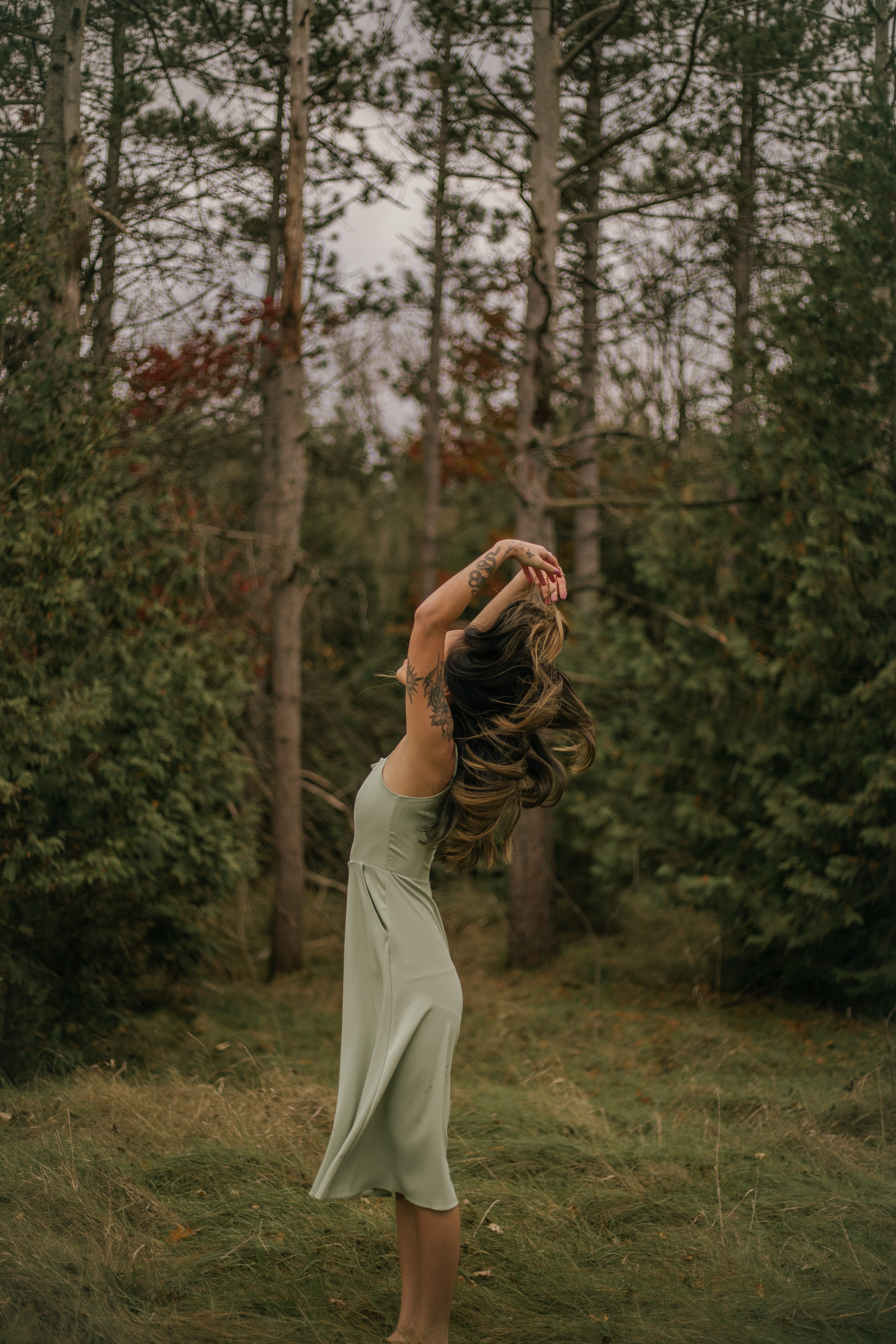 woman walking through the woods