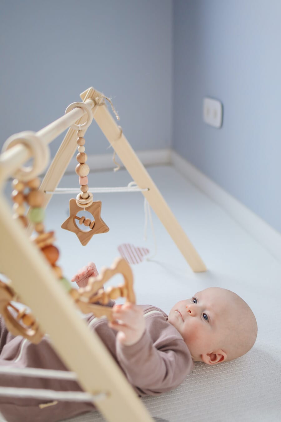 Newborn photoshoot idea at home: Interacting with Toys